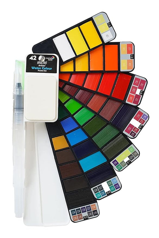 Set of watercolor pans with a brush on a white background