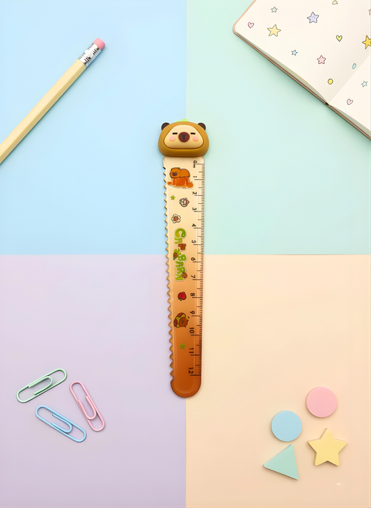 Ruler with bear design on a colorful background with stationery items
