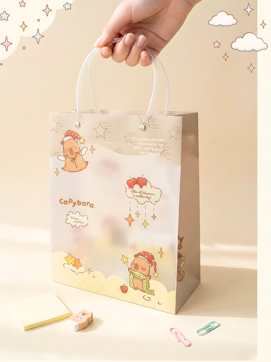 Gift bag with cartoon character design and 'CaPybara' branding on a beige background.