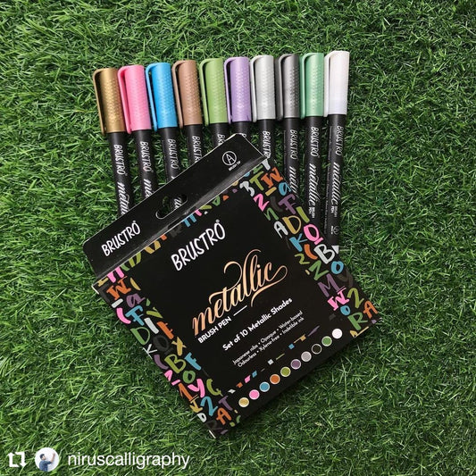 Set of Brustro metallic marker pens on a grass background