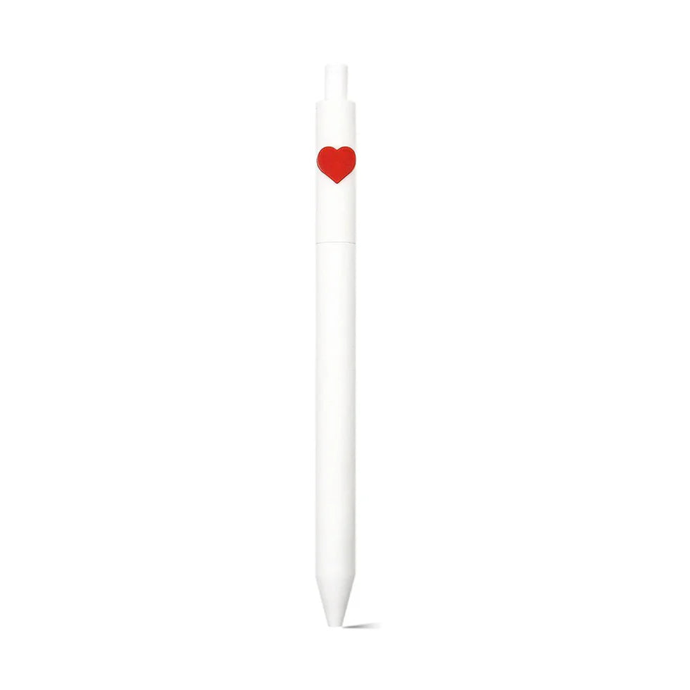 White candle with a red heart on a white background