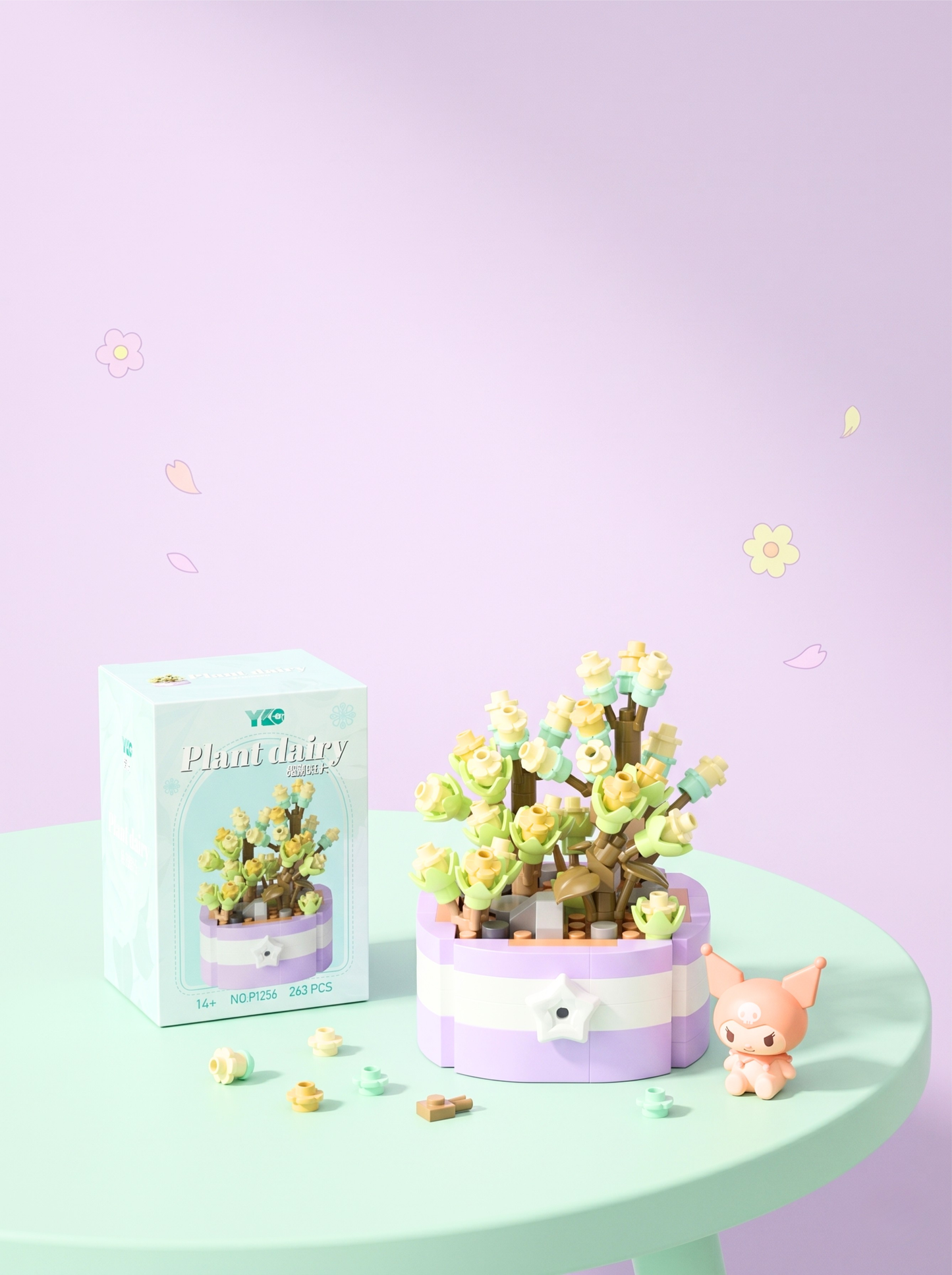 Small potted plant with a matching box on a light green table against a light purple background