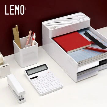 White desk organizer with stationery items on a white surface, featuring the brand 'LEMO'.