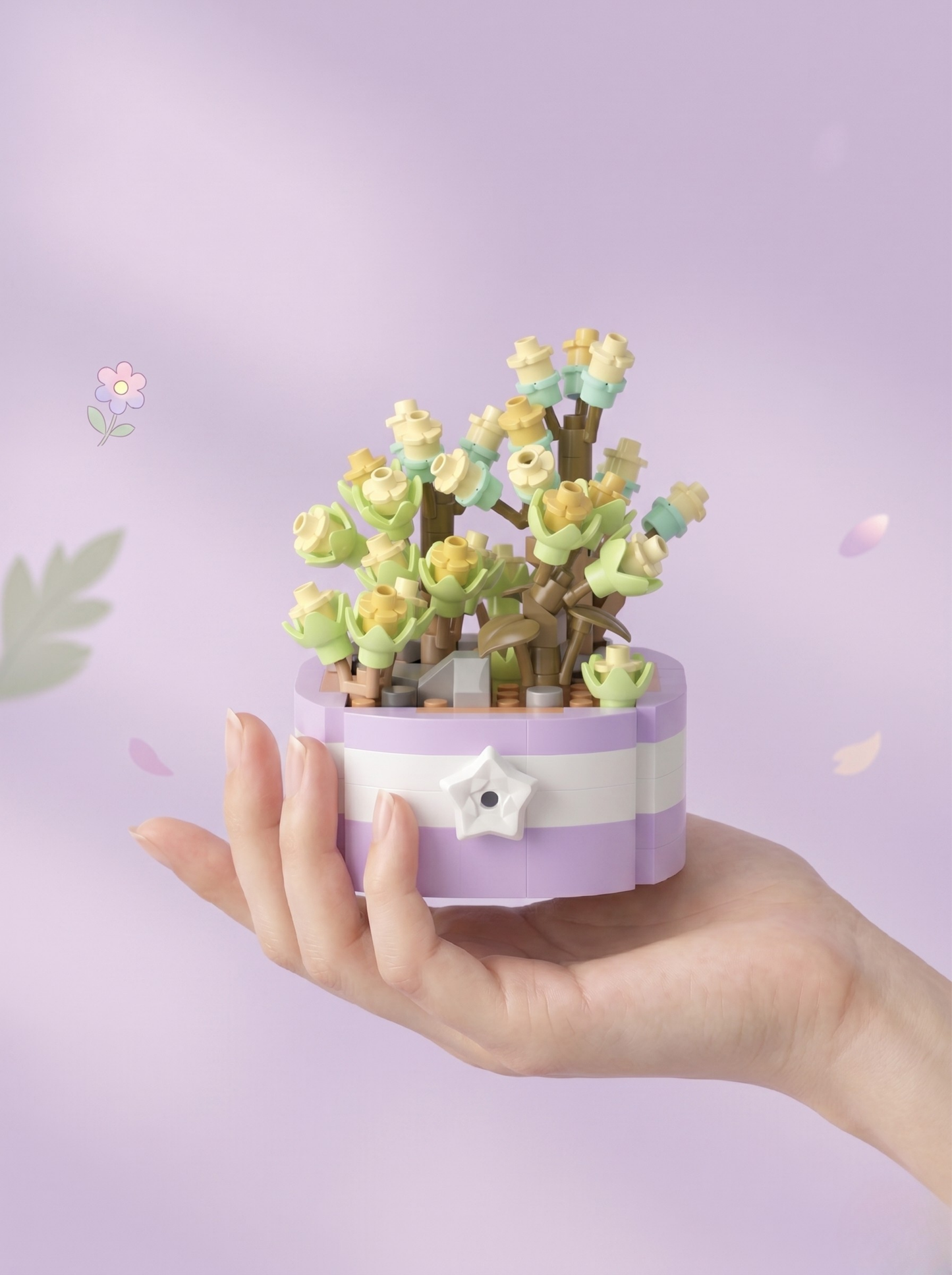 Hand holding a small potted plant with a decorative pot against a light purple background