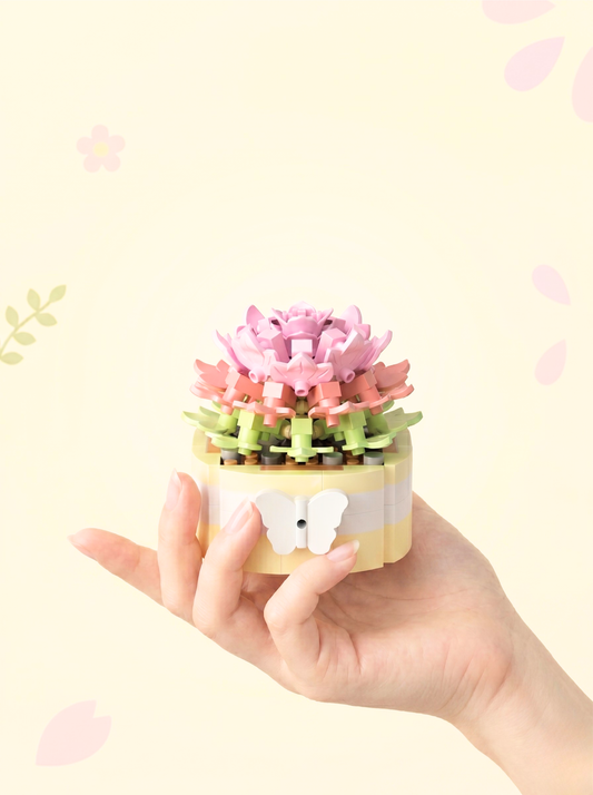 Hand holding a small, colorful flower-shaped object against a light background