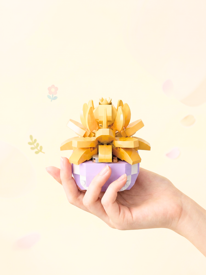 Hand holding a small purple container with a yellow flower-like structure on a light background