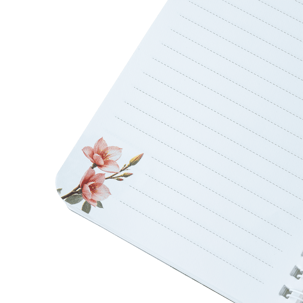 Notebook with floral design on a green background