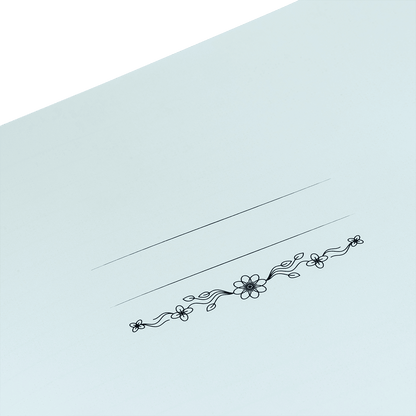 Decorative floral design on a light blue card with a green border
