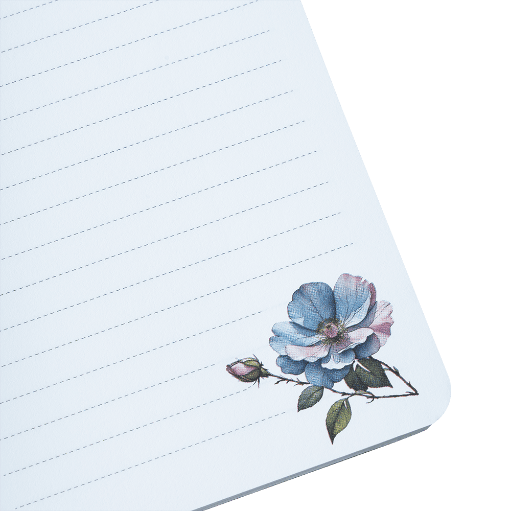 Notebook with floral design on a green background
