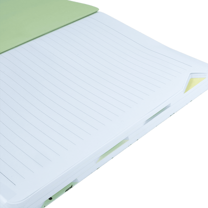 Notebook with green cover on a green background
