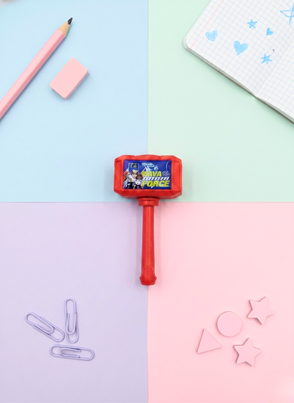 Red toy hammer with character design on a colorful background
