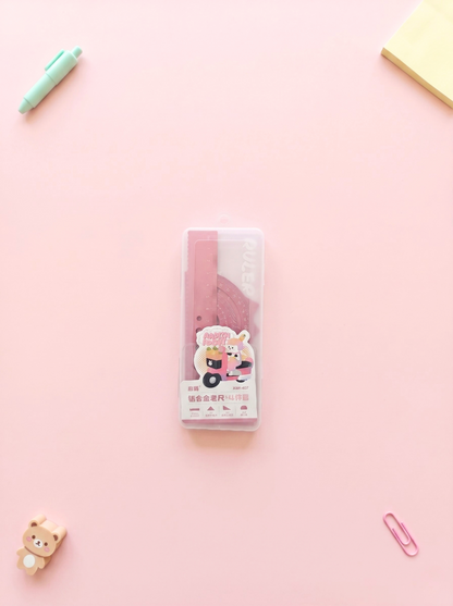 Pack of stationery items on a pink background