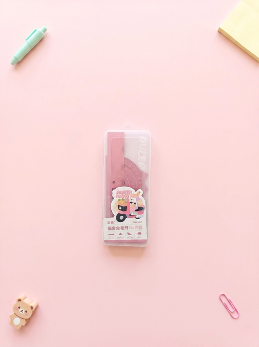 Pack of stationery items on a pink background