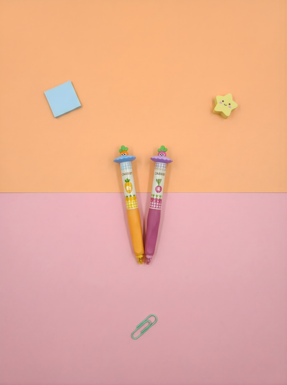 Two colorful pens with cartoon characters on a two-tone pink and orange background.