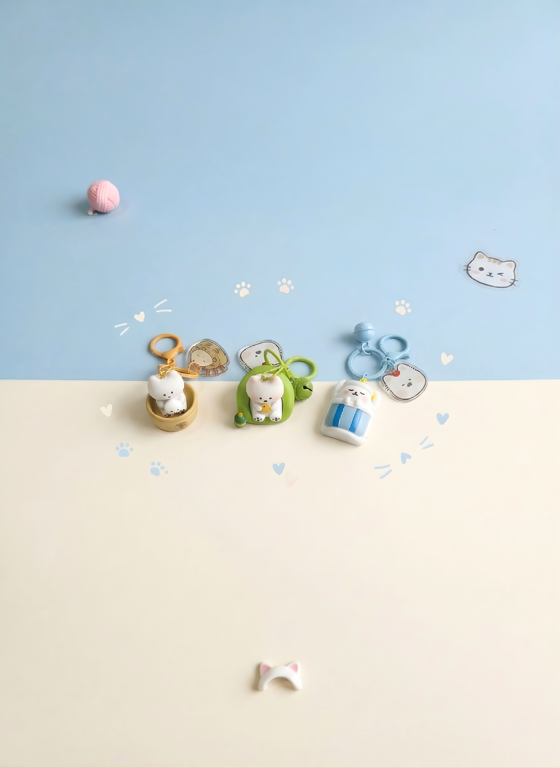 Small animal figurines on a beige surface with a blue background