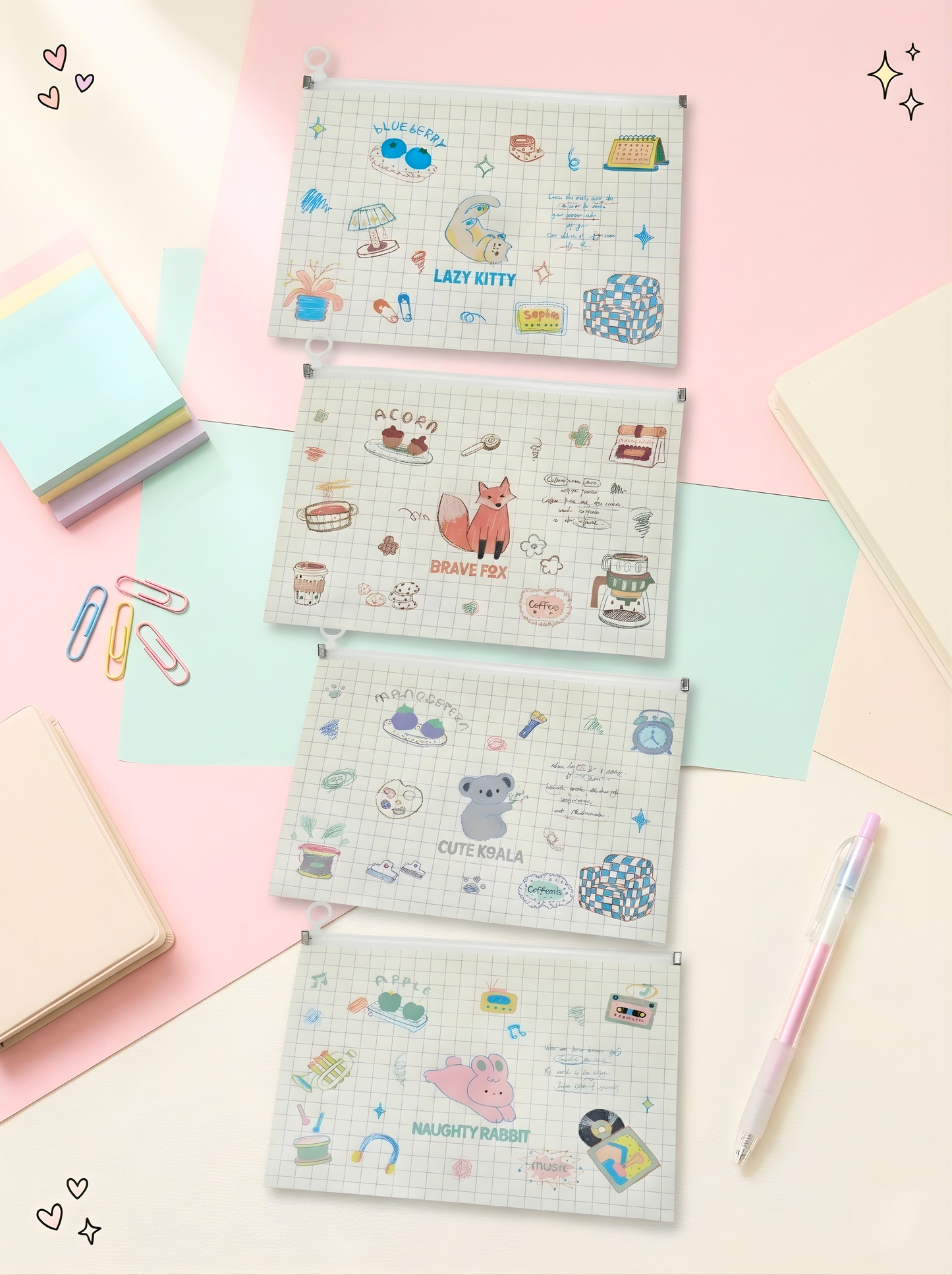 Set of four small notebooks with cute illustrations on a pastel background