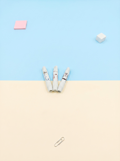 Three cigarettes on a beige surface with a light blue background