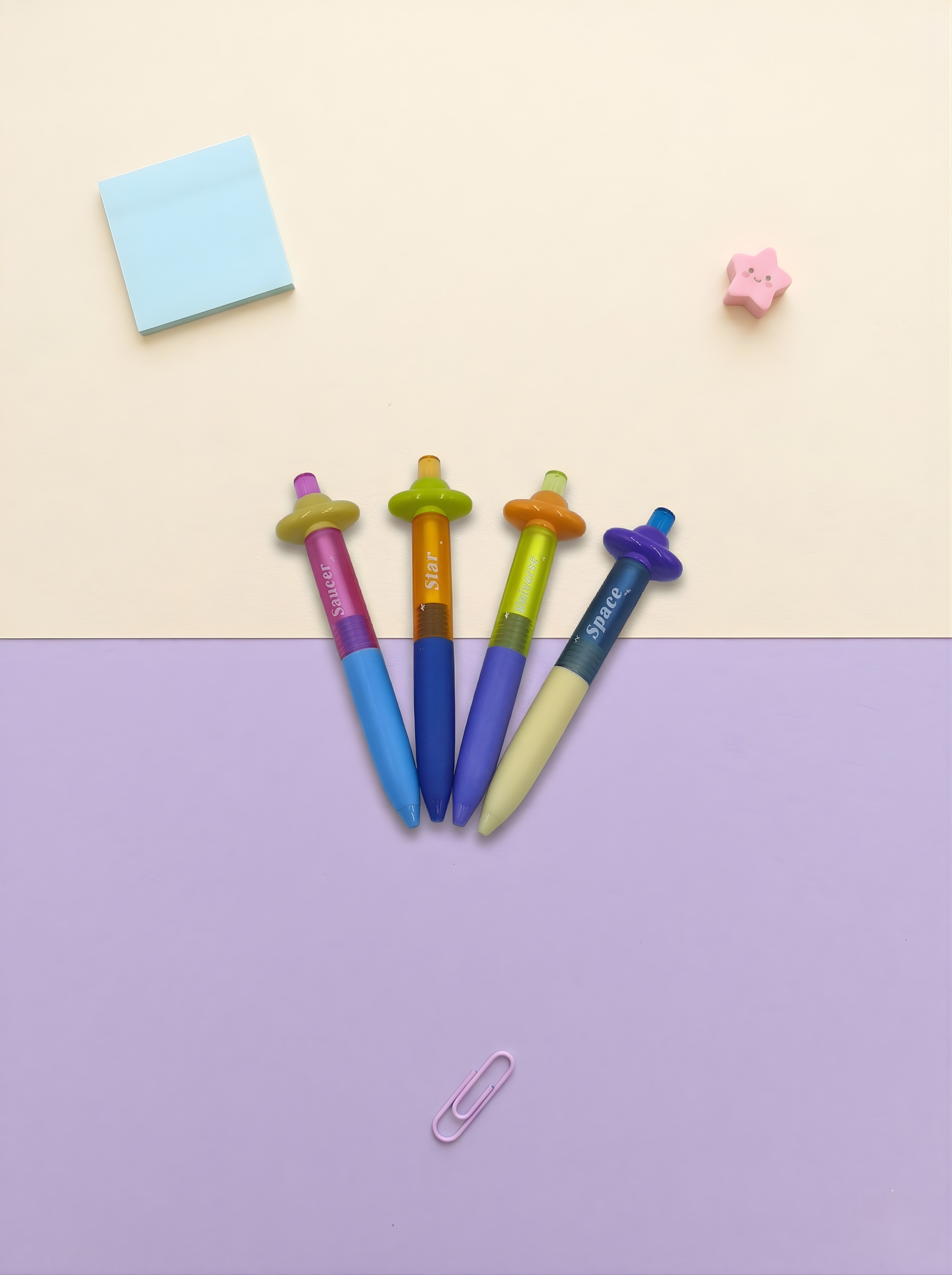 Colorful pens with unique designs on a two-tone background