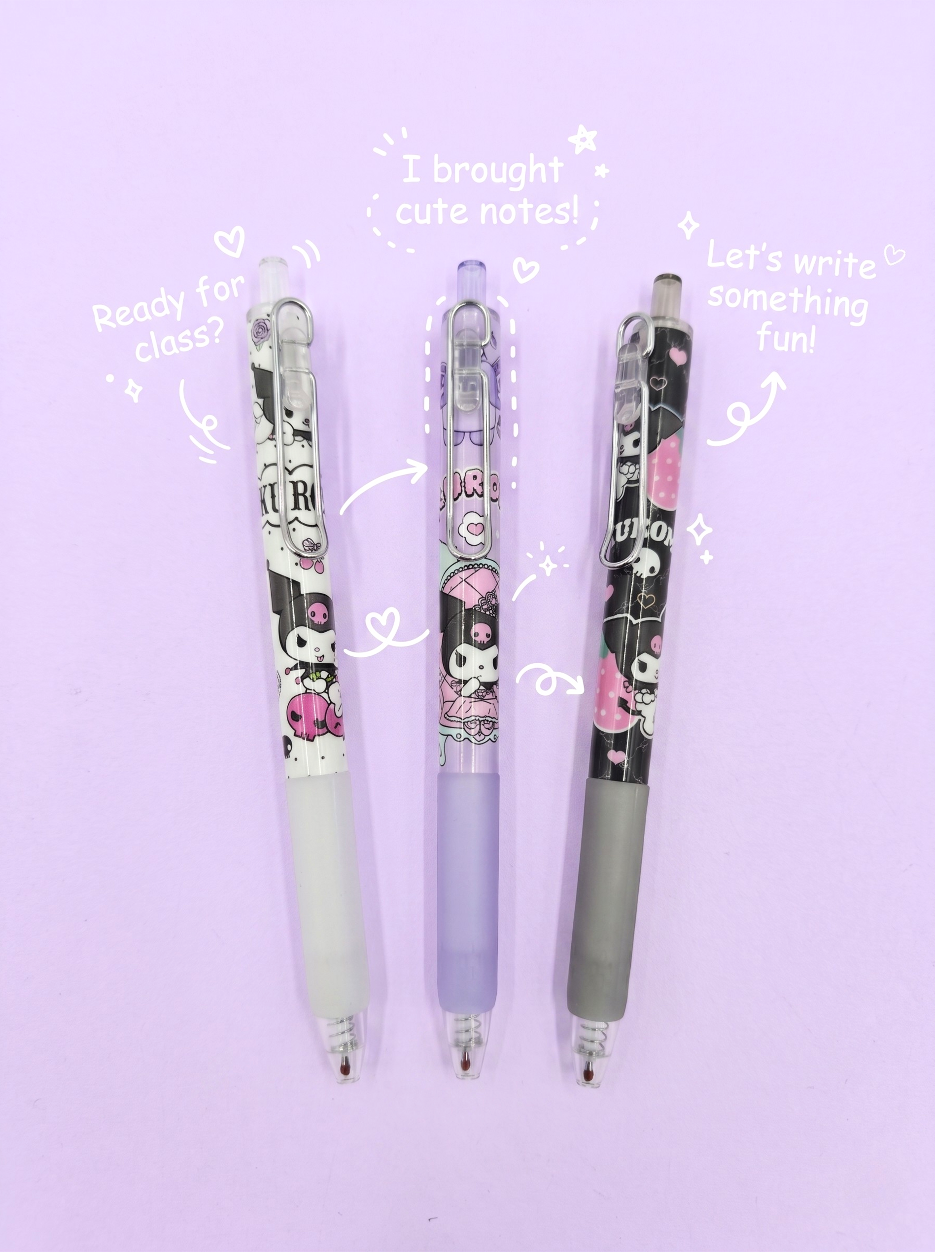 Three pens with cartoon designs on a light purple background