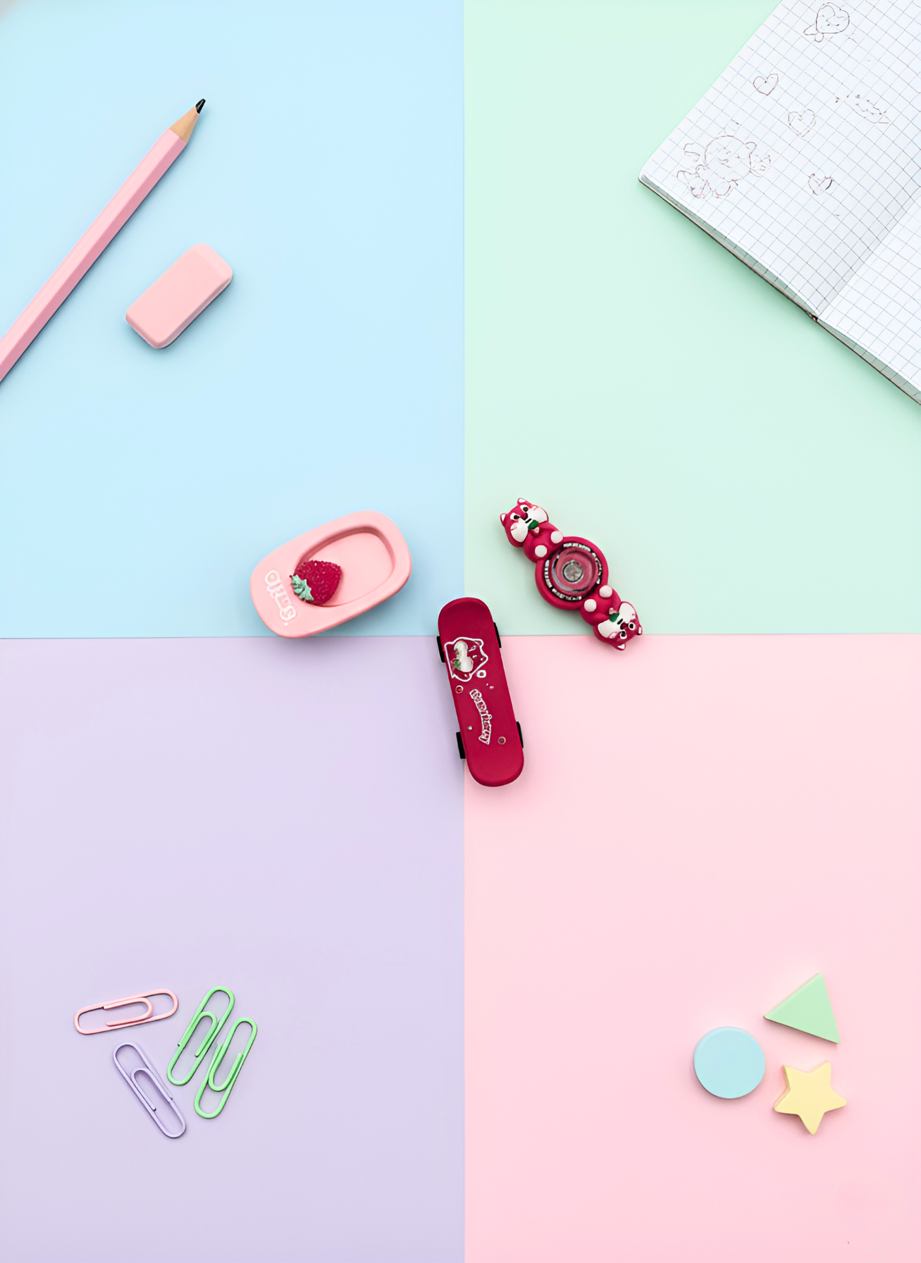 Assorted stationery items on a pastel-colored background