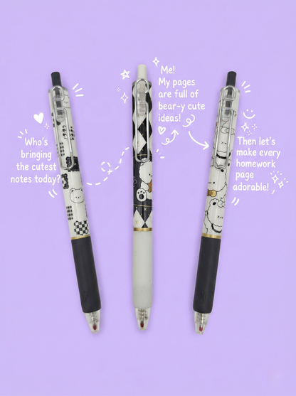 Three pens with cartoon designs on a purple background