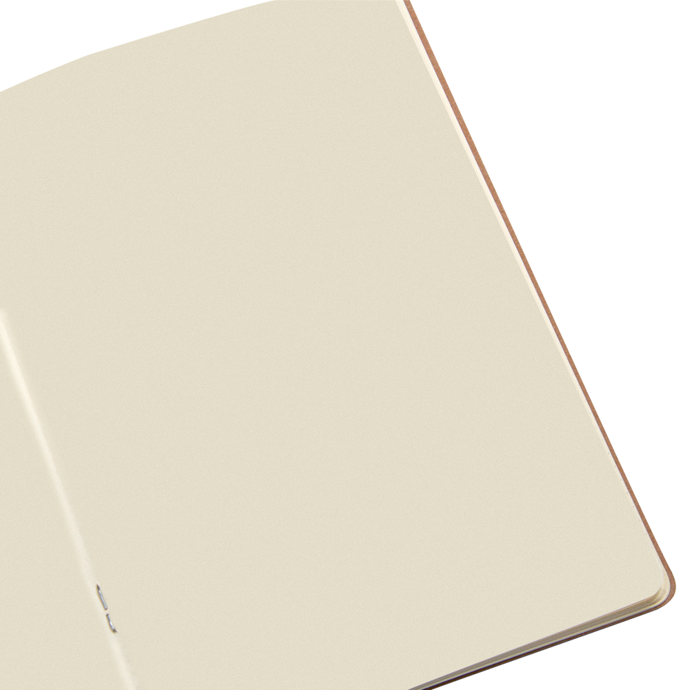 Beige notebook with a copper edge on a white background
