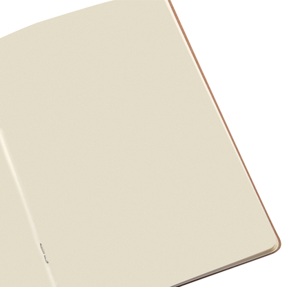 Beige notebook with a copper edge on a white background