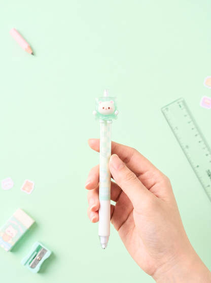 Hand holding a cute pen with a green background