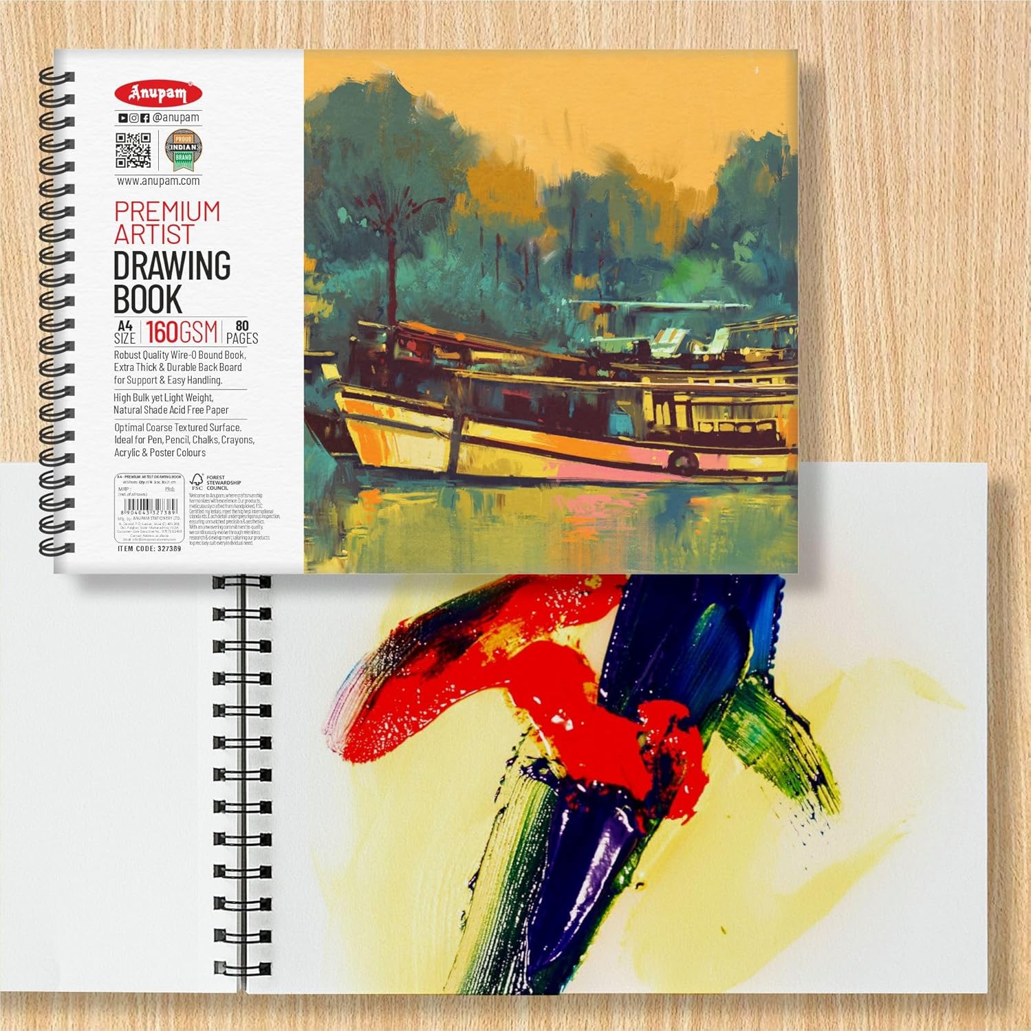 Artistic drawing book with colorful abstract painting on a wooden surface