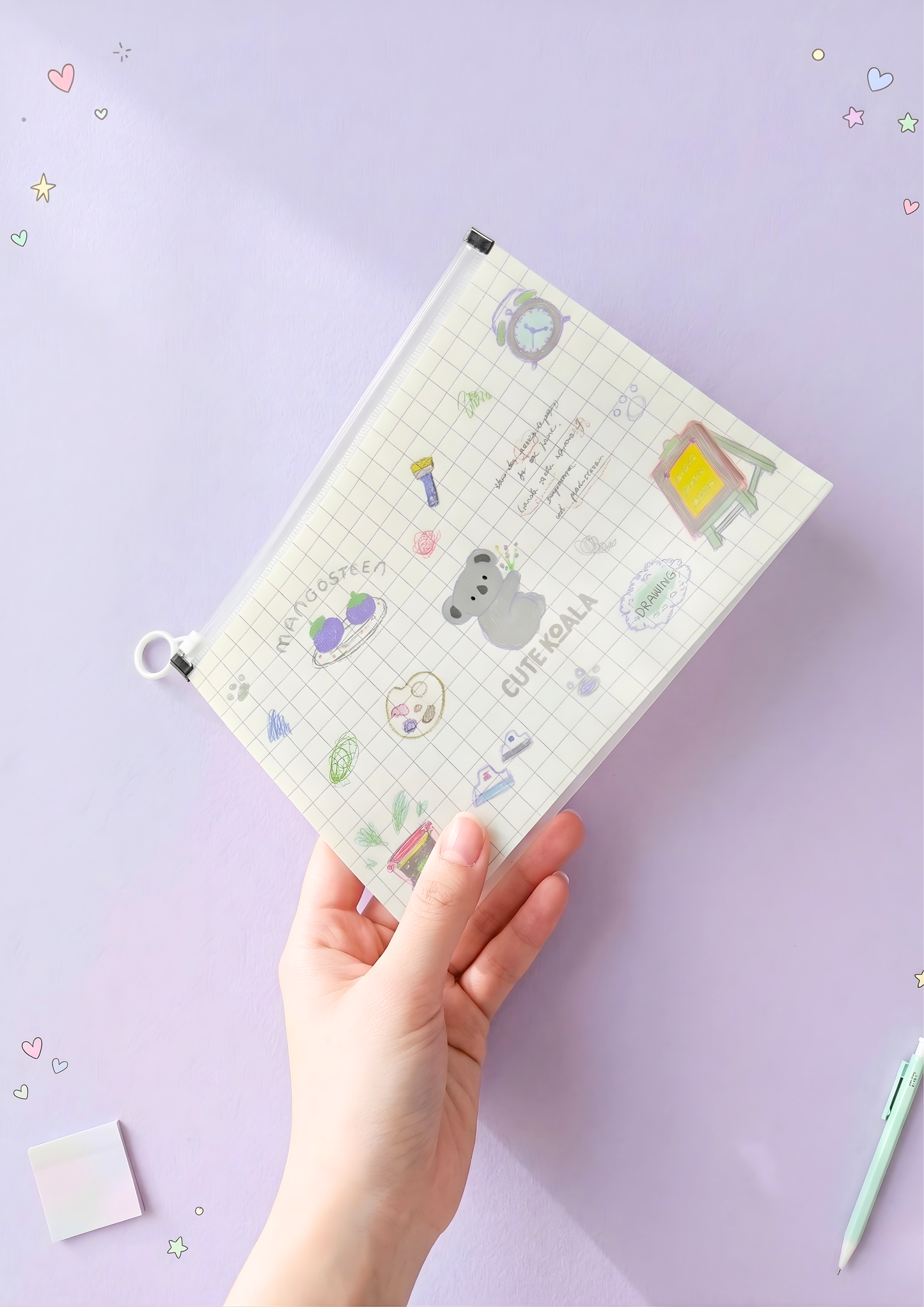 Hand holding a small file with cute illustrations on a light purple background