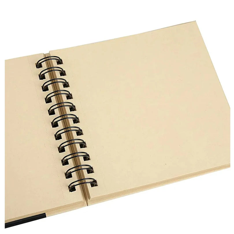 Open beige notebook with black spiral binding on a white background