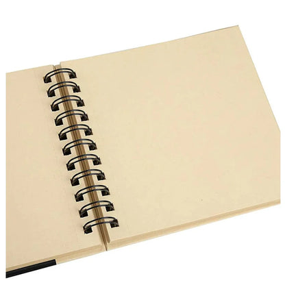 Open beige notebook with black spiral binding on a white background