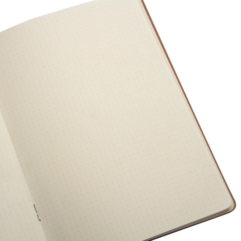 Beige notebook with a copper edge on a white background