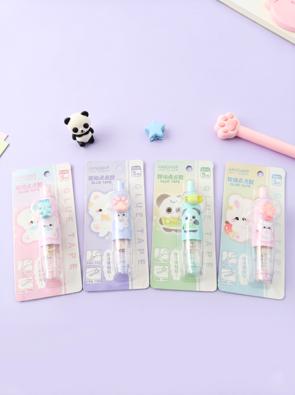 Four cartoon-themed修正带 (correcting tape) packages on a purple background
