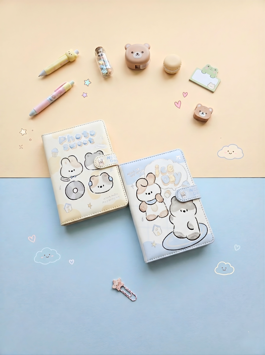 Two small notebooks with cute animal illustrations on a two-tone background with stationery items.