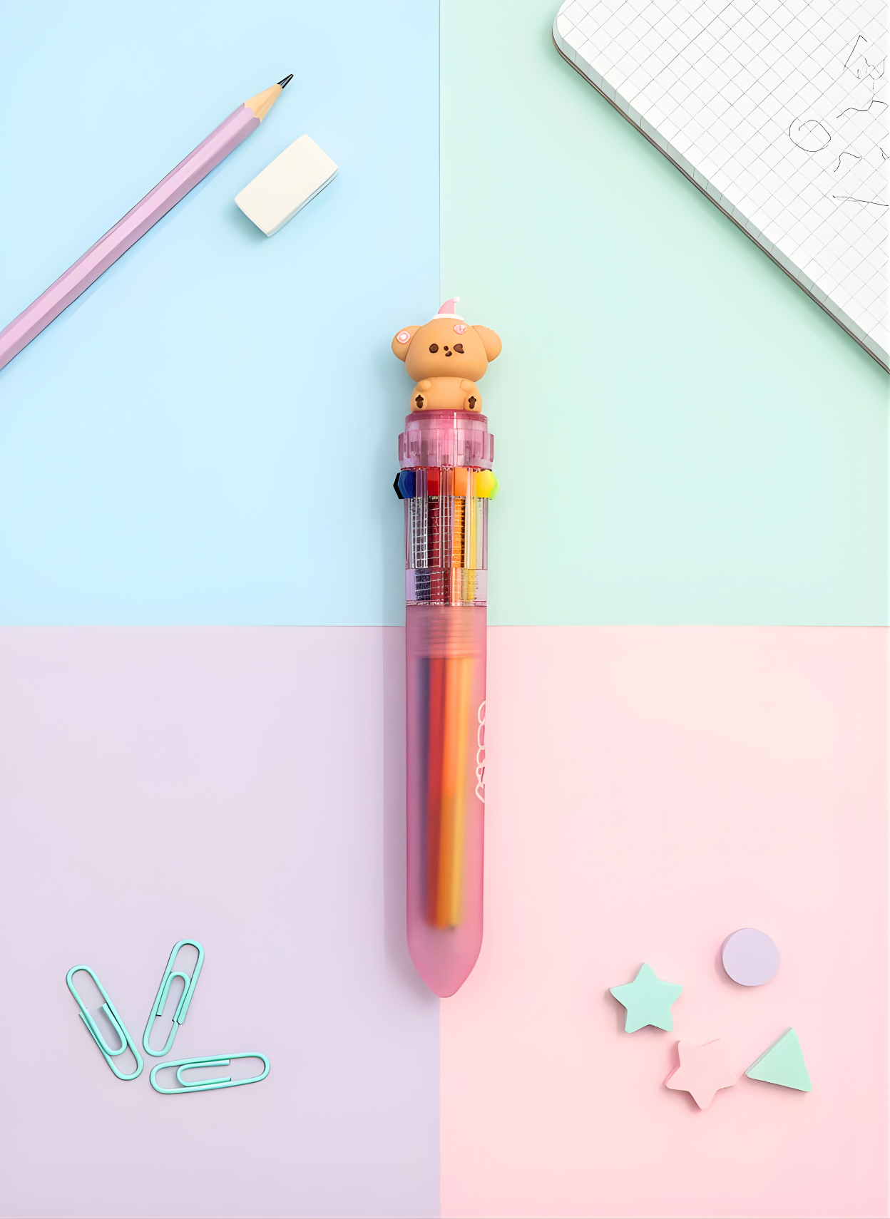 Colorful pen with a bear-shaped top on a pastel background