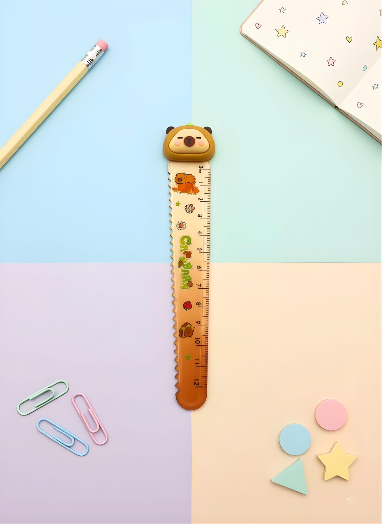 Ruler with bear design on a colorful background with stationery items