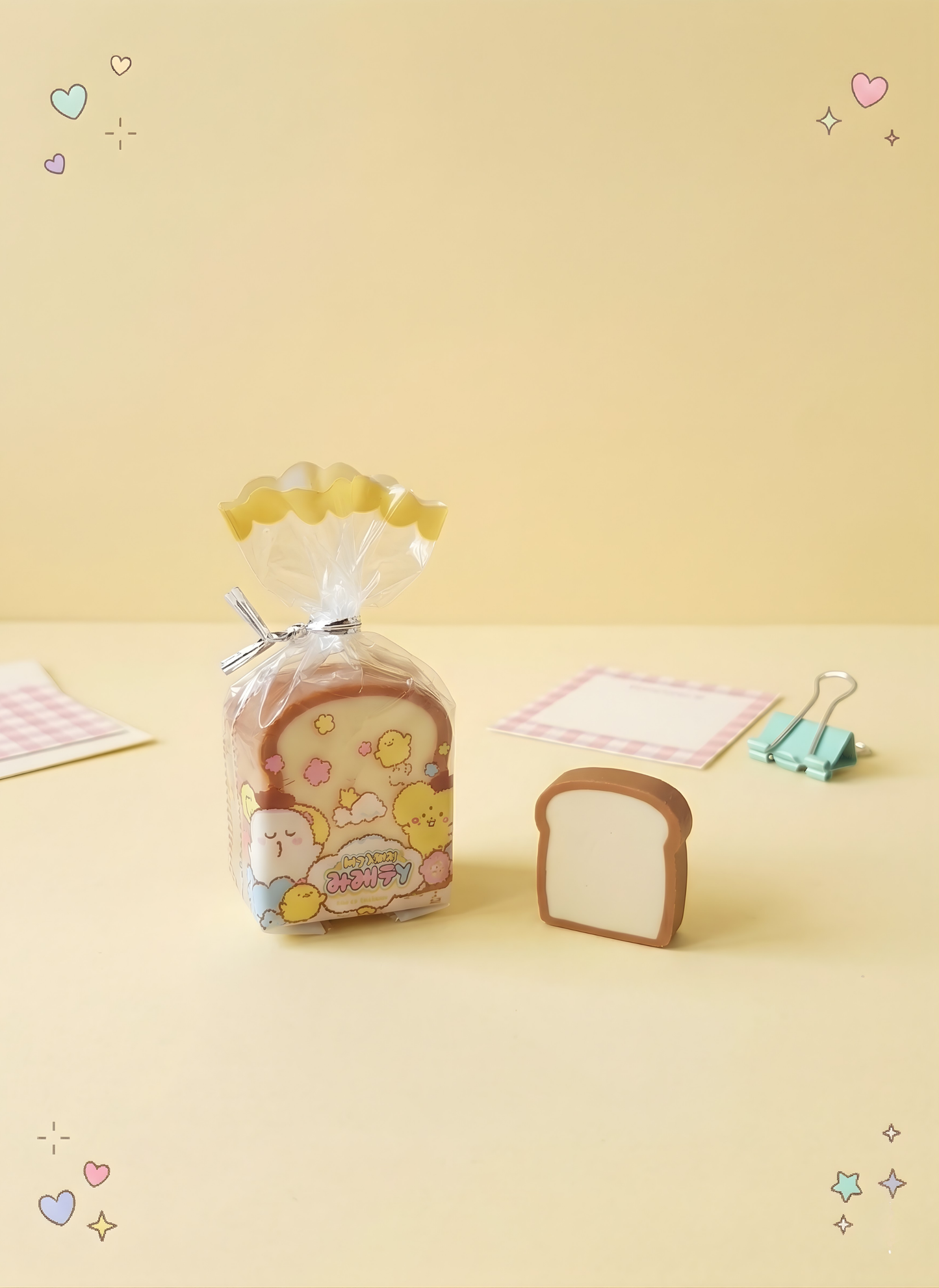 Packaged bread-shaped product with a cute design on a yellow background