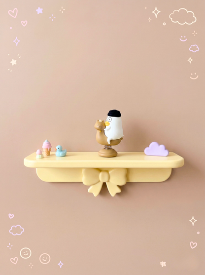 Decorative shelf with a bird figurine on a beige background