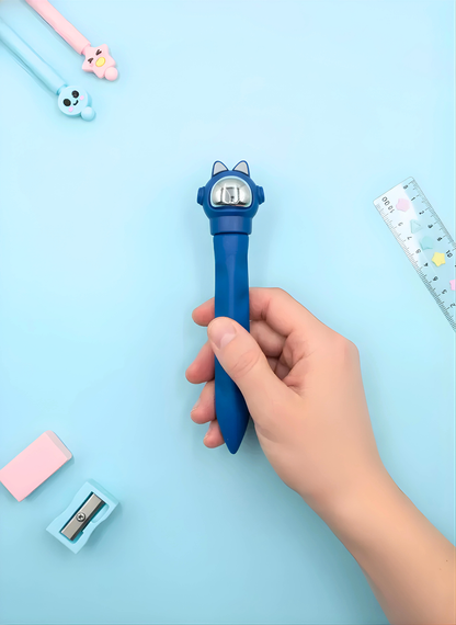 Hand holding a blue cartoon-themed pen with stationery items on a light blue background