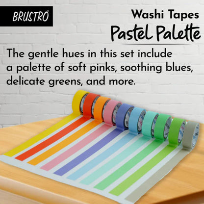 Set of colorful washi tapes on a wooden surface with a white brick wall background.