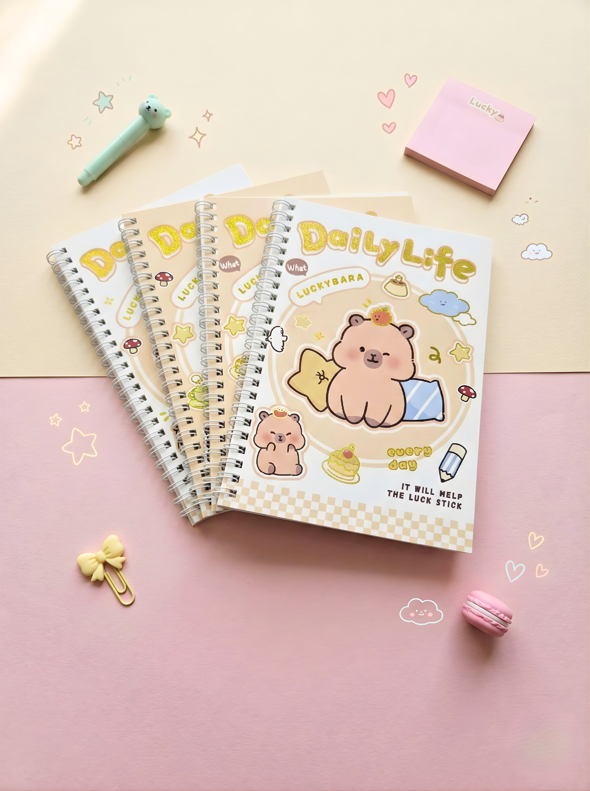 Set of notebooks with a bear illustration on a pink and beige background