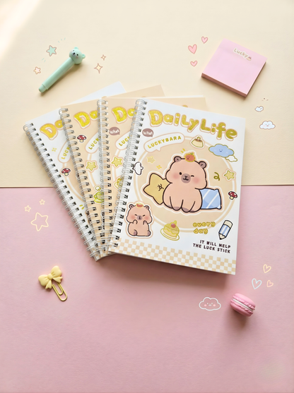 Set of notebooks with a bear illustration on a pink and beige background