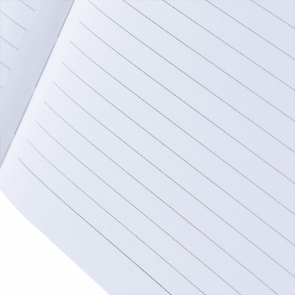 Close-up of a white notebook with horizontal lines on a light gray background