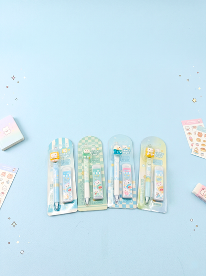 Set of stationery items including pens and stickers on a light blue background