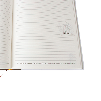 Open notebook with lined pages and a quote on a white background