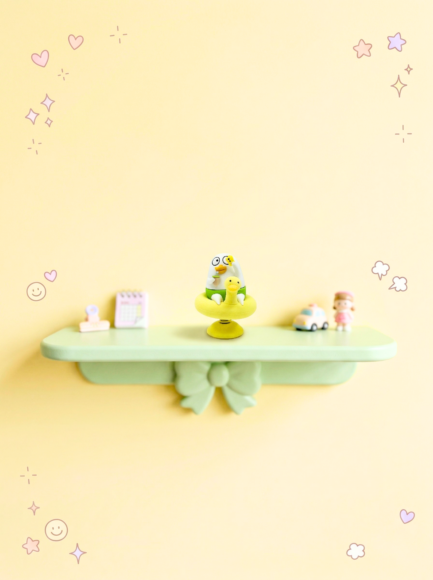 Green shelf with decorative items on a yellow wall with star and heart stickers.