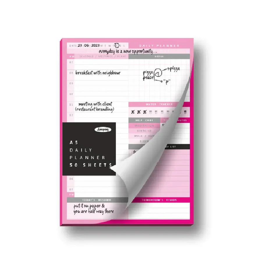 Pink daily planner with a clear flap showing the inside pages on a white background