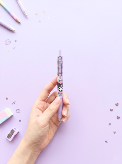 Hand holding a cartoon-themed mechanical pencil against a light purple background with decorative elements.