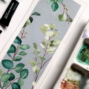 Floral design on a product with a brush and ink bottle in the background